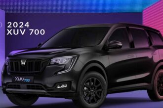 Mahindra xuv700 black car with blue and purple background